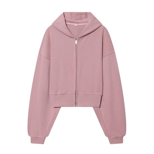 Detailed view of dusty pink zip-up hoodie featuring dropped shoulders and metal zipper