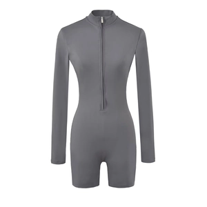 Detail of dark grey slim fit romper featuring front zipper and high stand collar design