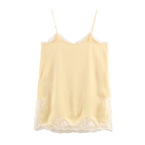 Elegant yellow silk camisole top featuring intricate white lace trim for a stylish summer look