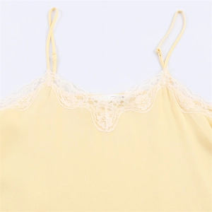 Light yellow camisole top with white lace V-neck trim and adjustable thin straps