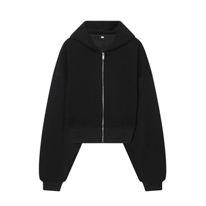 Macro shot of short black zip-up hoodie featuring ribbed cuffs and white size S label