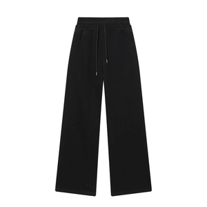 Detail of high waist wide leg trousers with elastic waistband and metal tip drawstring