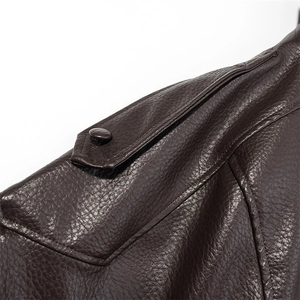 Detail of dark brown PU leather jacket showing shoulder epaulet and fine grain texture