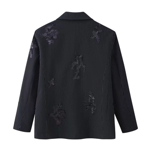 Detailed back view of a black pinstripe blazer featuring sequins floral embroidery