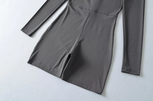 Detailed view of dark grey slim-fit bodysuit with high-stretch fabric and flatlock stitching