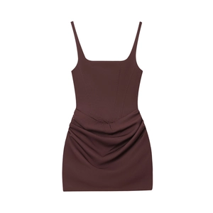 Detail view of dark brown corset style sleeveless dress with ruched textured skirt