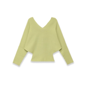 Detail view of the light green knit top featuring a deep V-neck and batwing sleeves
