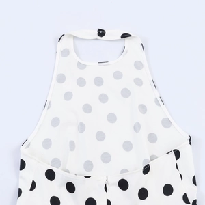 Detailed view of back neckline with halter strap buttons and hidden zipper closure