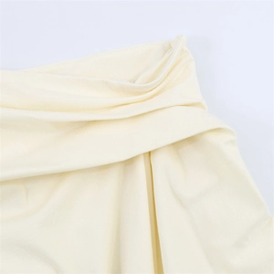 Detail view of cream pleated knit fabric with high-quality invisible zipper closure