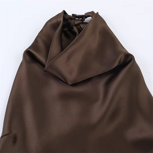 Deep brown satin halter neck dress with smooth glossy finish and elegant drapery