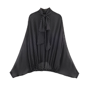 Elegant polka dot chiffon blouse with tie-neck bow and batwing sleeves on white background