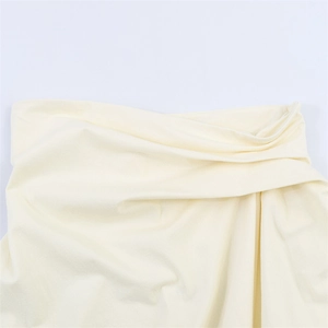 Beige backless tube top with twisted front pleated detail and soft knit fabric
