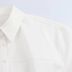 Women's minimalist white cotton shirt dress with turn-down collar and twill texture