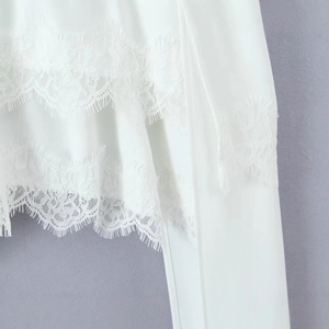 Elegant white chiffon top featuring delicate double-layered eyelash lace hem details