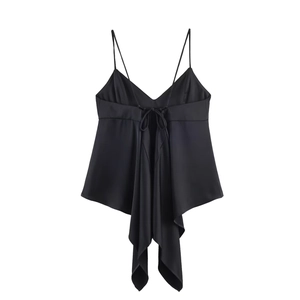 Detail of black satin camisole featuring back bow tie and asymmetric draped hemline