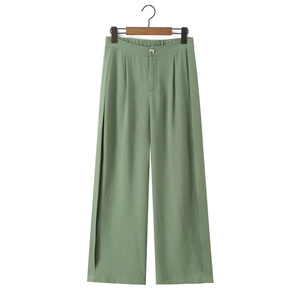 Detail view of bean green high waist wide leg trousers with side slits and metal button