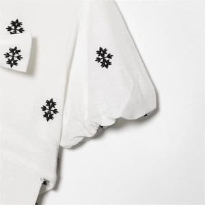 White puff sleeve dress with floral embroidery and natural textured linen fabric