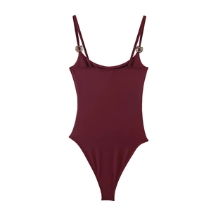 Close-up of wine red bodysuit featuring thin shoulder straps and metal ring accents