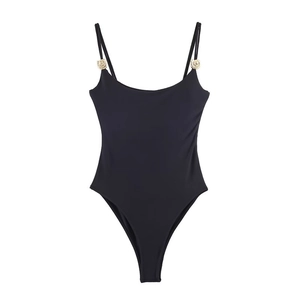 Detail of black bodysuit featuring gold metal rings and thin adjustable straps