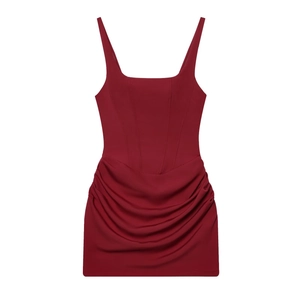 Detail of dark red sleeveless bodycon dress with corset-style bodice and pleated skirt