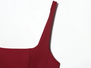Detail of square neckline and wide straps on a wine red textured bodycon dress
