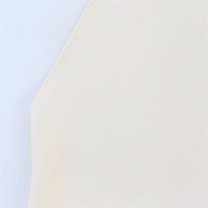 Close-up of fine double-needle stitching on beige halter top strap with smooth knit fabric
