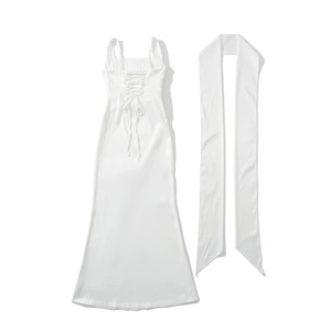 Lace-up back detail of a white satin maxi dress featuring elegant silk texture and cross ties