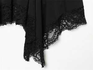 Close-up of elegant black lace hem detail on a lightweight chiffon dress fabric