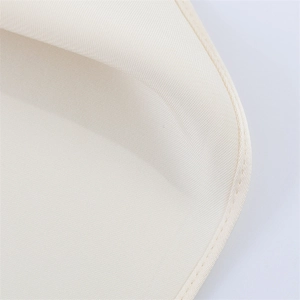 Macro shot of the beige woven fabric texture and high-quality hem stitching detail