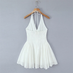 Elegant white lace halter neck mini dress with intricate crochet details and a pleated skirt
