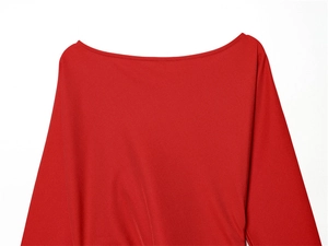 Detail of red boat neck dress featuring slim fit design and premium knit fabric texture