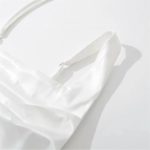 White satin corset dress with adjustable straps and elegant cowl neck draping detail