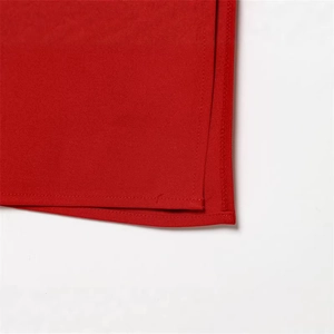 Close-up of red slim-fit dress fabric showing premium stitching and overlock details