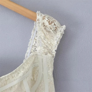 Chic cream floral lace mini dress with ruffled shoulders and bow details in vintage style