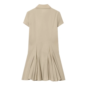 Detail view of beige shirt dress back featuring unique multi-layered pleated fishtail hemline