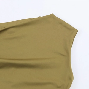 Close-up of olive green blouse showing draped neckline and smooth satin fabric texture