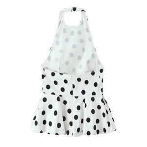 Haut à pois avec dos nu et ourlet péplum en tissu blanc léger et respirant
