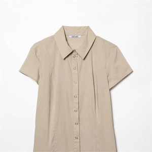 Khaki short sleeve lapel shirt dress with metallic snap buttons on white background