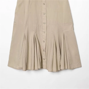 Chic beige button-down skirt featuring a pleated hem design in high-quality cotton blend