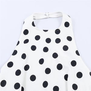 Haut dos nu chic à pois avec fermeture à double bouton et détail élégant au cou