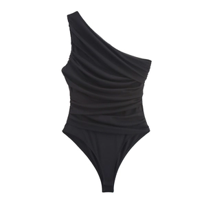 Detailed view of black asymmetrical one-shoulder bodysuit with ruched front details