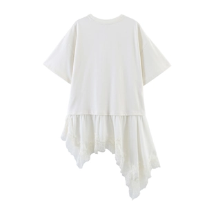 Detail of the asymmetrical hem with delicate white lace patchwork on this satin T-shirt