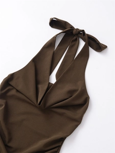 Detail of coffee brown halter neck dress showing elegant pleated neckline and fabric texture