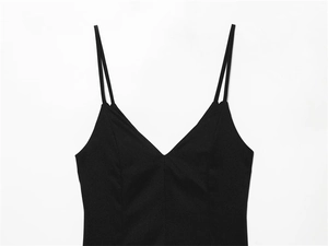 Detailed view of black deep V-neck romper dress with double spaghetti straps and clean seams