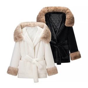 Detailed view of faux fur coats with wide collars and quilted lining in white and black
