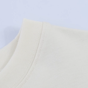 Close-up of beige ribbed knit neckline with fine stitching for women's elegant satin tee