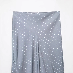 Elegant silver satin midi skirt with white polka dots and a smooth glossy finish