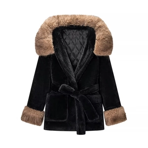 Detail of black faux fur coat showing quilted lining and luxurious brown fur collar