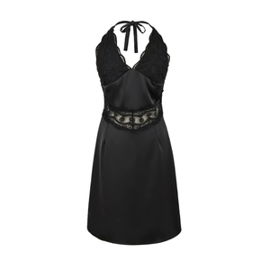 Close-up of black lace patchwork and silky satin fabric on the halter mini dress