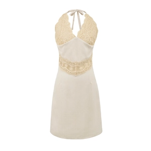 Detail of crochet floral lace stitching and V-neckline on apricot halter mini dress